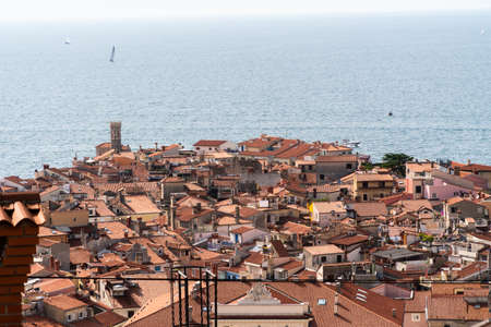 Old town in Piran Slovenia with sea in the backの写真素材