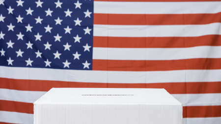 White ballot box with American flag at presidential elections.