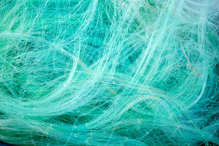Pile of fishing nets. Detailed pattern and texture.の写真素材