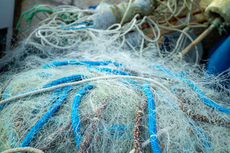 Pile of fishing nets. Detailed pattern and texture.の写真素材