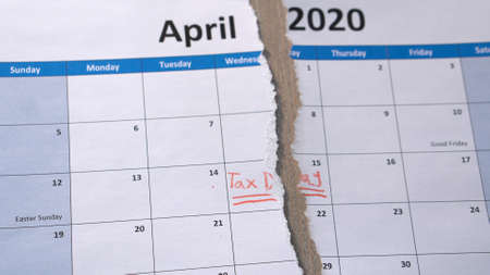 Scraped Tax day on April 2020 calendar. Filing deadline pushed back to July 15.の写真素材