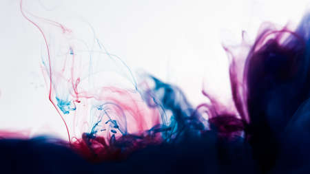 Cloud of color ink in water isolated on white. Abstract design and texture.