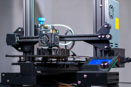 3D plastic printer during work in a factory three dimensional printing. Close-up detail.の写真素材