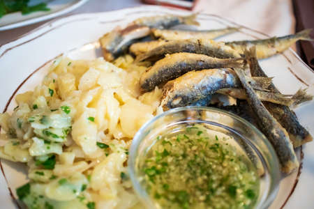 Grilled Sardines on a plate in a restaurantの写真素材