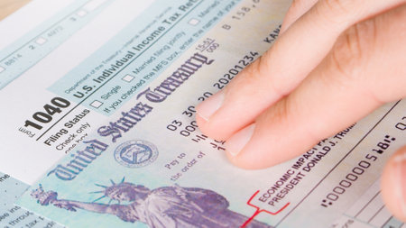 Stimulus economic tax return check and 1040 Form.