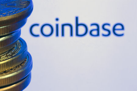 Coinbase logo on screen with Bitcoin coins. Ljubljana, Slovenia - April 06 2021のeditorial素材