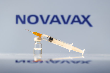 Novavax Coronavirus Vaccine vial and syringe with logo as background. LJUBLJANA, SLOVENIA: March 25, 2021のeditorial素材