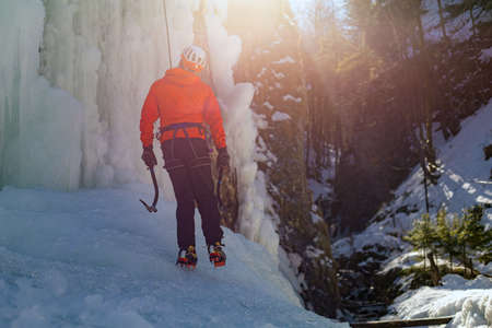 Male ice climber preparing for a climb