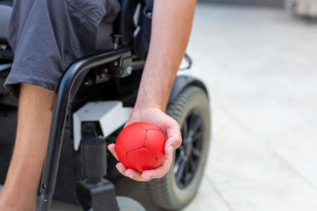 Disabled Boccia player playing on a wheelchair