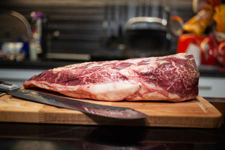 Raw Picanha steak cut on a wooden plateの写真素材