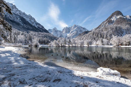 Mountain lake Jasna in Kranjska gora Slovenia covered with snow.の写真素材