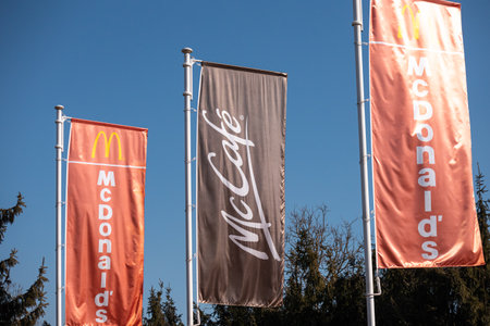 Slovenia, Ljubljana - March 9 2022: McDonalds logo against the sky, worlds largest chain of fast food restaurantsのeditorial素材