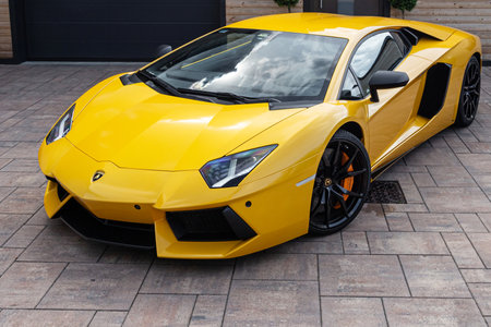 Slovenia, Ljubljana - July 5 2021: Yellow luxury supercar Lamborghini Aventador on street.のeditorial素材