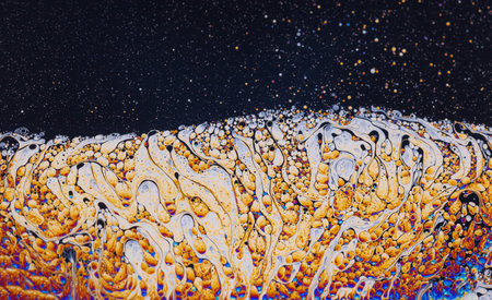 Fluid soap bubble psychedelic colorful abstract art. Surreal patterns with rainbows and waves of color in motion.の写真素材