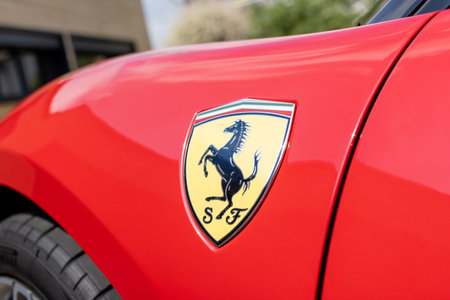 Slovenia, Ljubljana - 2 June 2022: Red Ferrari F8 Tributo Italian luxury sports car logo