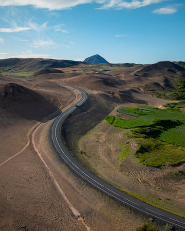 Panorama view of Ring Road in Iceland and scenic landscape of volcano rock formations on a bright summer day, aerial shot. Travel destination concept.の写真素材