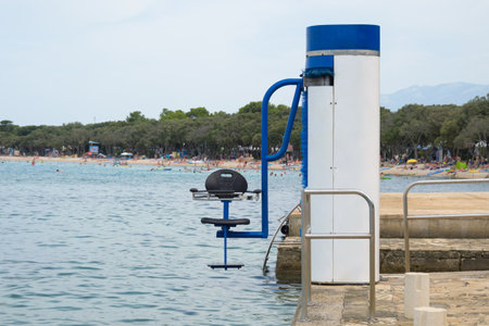 Swimming lift at sea for people with disability. Accessible beach and access to water.の写真素材