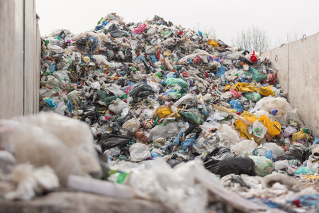 Landfill with trash and garbage polluting environment waiting to recycleの写真素材