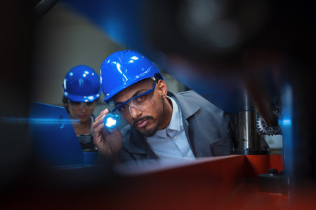 Engineers check control heavy machinery in Industrial factory for maintenance and safety.の写真素材