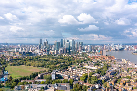 London, the city on the river bank, with residential buildings, green areas, and modern skyscrapers, aerial view.の写真素材