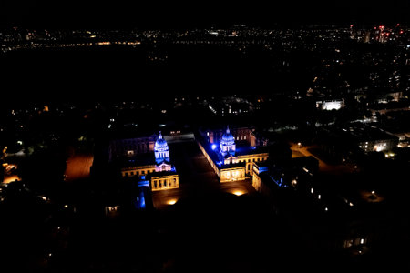 Nighttime London's cityscape view, business, and residential buildings lights on the horizon, drone shot.の写真素材