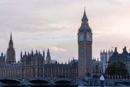 Palace of Westminster with its distinctive Tower of Big Ben at sunset and beautiful coloured sky,...
