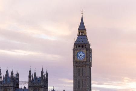 Palace of Westminster with its distinctive Tower of Big Ben at sunset and beautiful coloured sky, handheld shot.の写真素材