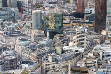 Panoramic view of London city skyline illuminated by colorful sunset light, aerial shot. Famous landmark buildings and architectural attractions on the river banks.の写真素材
