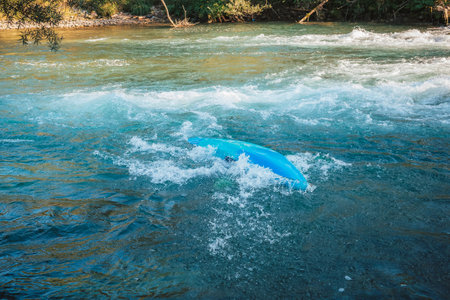 Kayaker capsized into the river while paddling. Flip and turn in a kayak.の写真素材