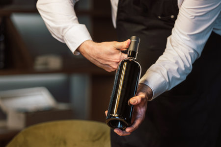 People drinking wine and eating cold cut meat in a wine cellar.の写真素材