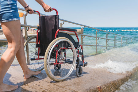 Accessible beach with wheelchair with ramp for persons with disabilityの写真素材