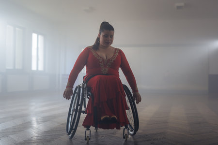Woman para dancing, spinning, and whirling in the ballroom during training class. Dance and disability concept.の写真素材