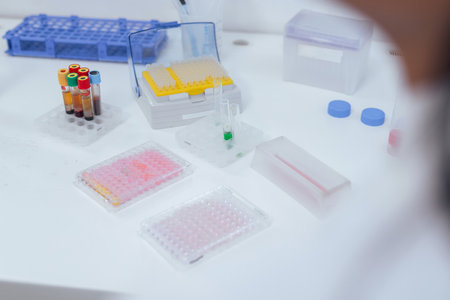 Transferring samples to microplate from multi channel pipette during scientific laboratory research....