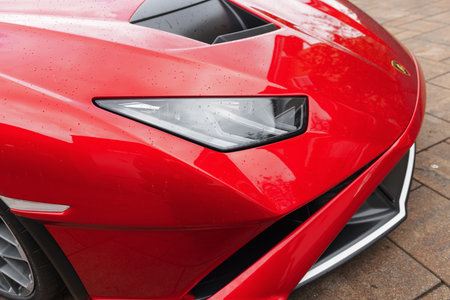 Slovenia, Ljubljana - 9 October 2025: Lamborghini Huracan STO stands out in a parking area with raindrops on its body.のeditorial素材