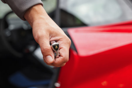 Slovenia, Ljubljana - 9 October 2025: Lamborghini Huracan STO key held firmly in handのeditorial素材