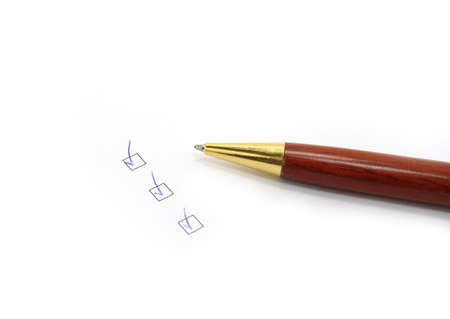pen and checkboxes on a white background. close-up               の写真素材