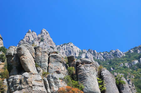 Mountains on a  blue sky backgroundの写真素材