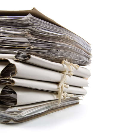 Pile of paperwork on a white background. Close-up.