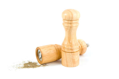 Salt and Pepper shakers and milled pepper on a white background.の写真素材