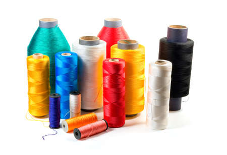 Set of color bobbins on a white backgroundの写真素材