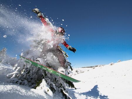Jumping snowboarderの写真素材