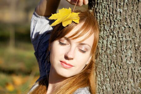Young woman in autumn parkの写真素材