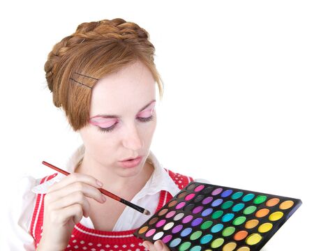 Young beautiful girl with cosmetics color shadowsの写真素材