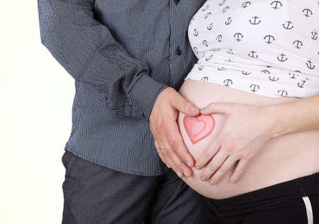 young pregnant woman with man isolated on white 
