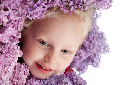 beautiful little girl with branch of lilacの写真素材