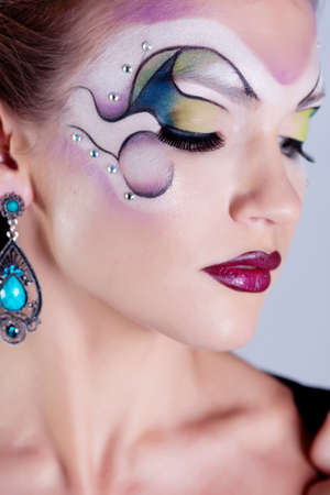 Girl with painted faceの写真素材