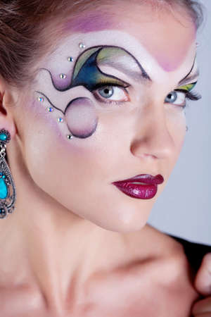 Girl with painted faceの写真素材