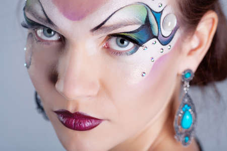 Girl with painted faceの写真素材