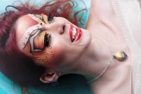 Girl with painted faceの写真素材