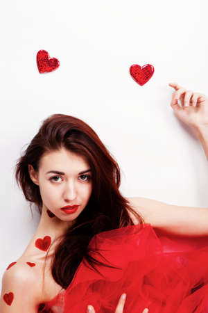 Brunette girl with red hearts isolated on whiteの写真素材